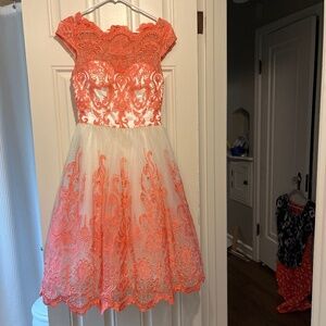 Vintage-inspired coral and cream lace dress